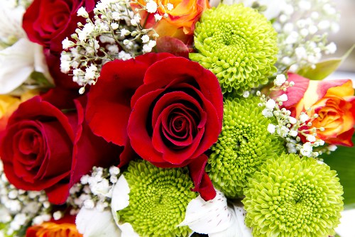 Colorful tulips and roses in a floral arrangement